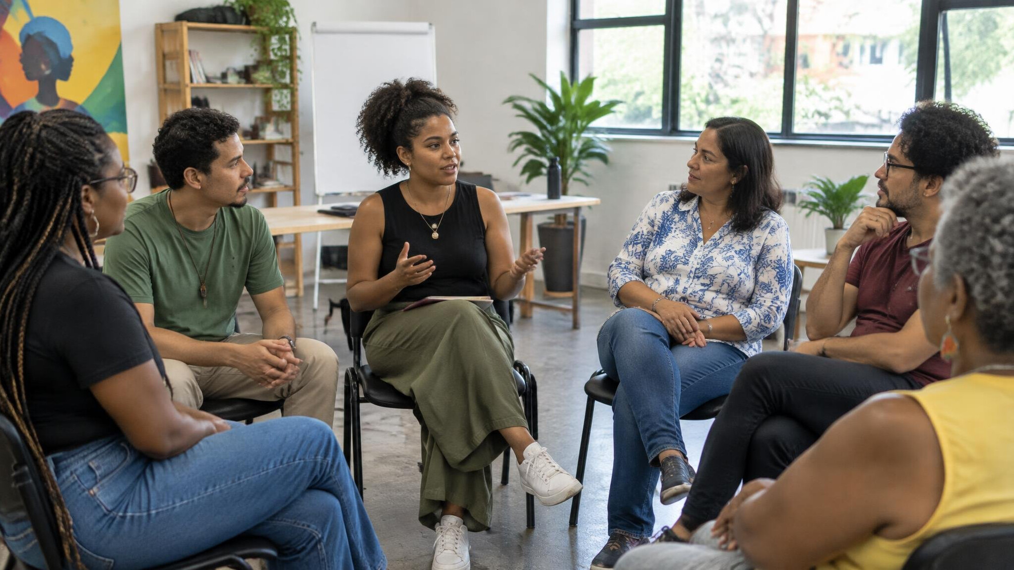 Diverse group of people in a workshop-style discussion circle