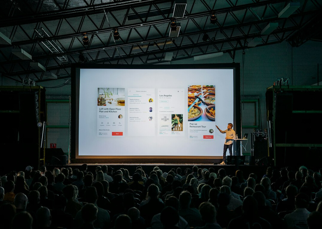 person giving presentation to audience